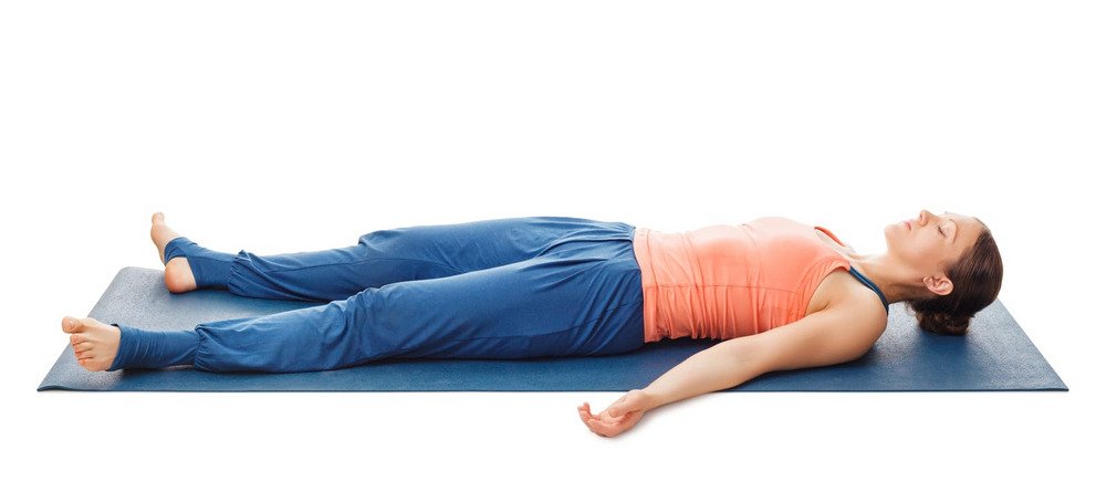 Women Relaxes In Yoga Asana Savasana